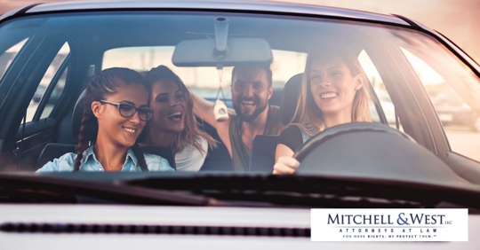 group of friends riding in a car together